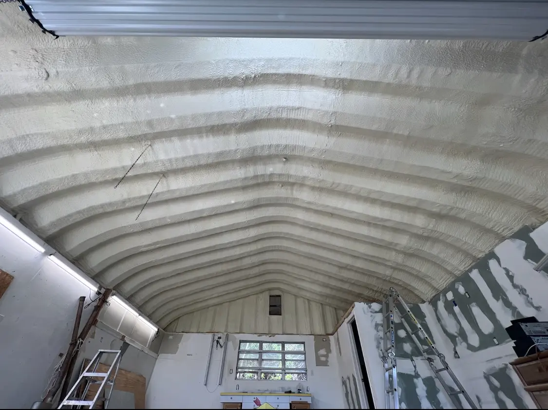Spray polyurethane foam applied to the underside of a metal roof deck in Babylon
